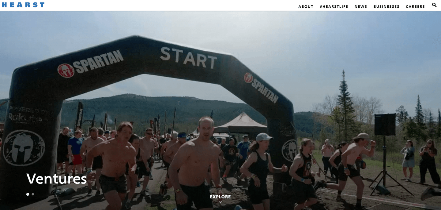 Hearst Ventures landing page showing runners at a Spartan race start line with the Hearst logo in the header.
