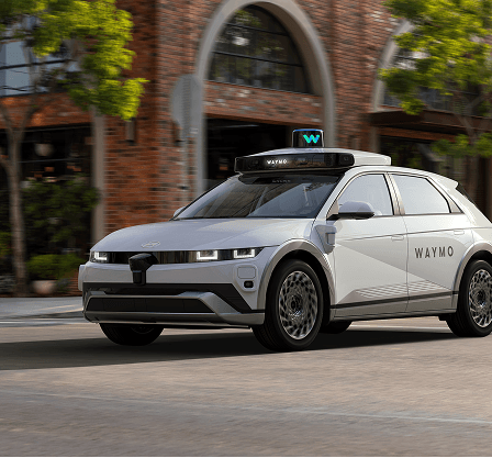 image of a waymo self-driving car on the street