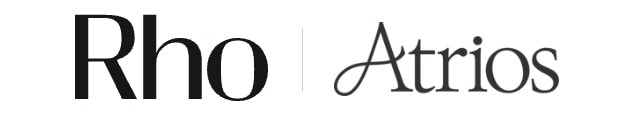 Stylized text logo displaying "Rho" and "Atrios" separated by a vertical line on a white background.