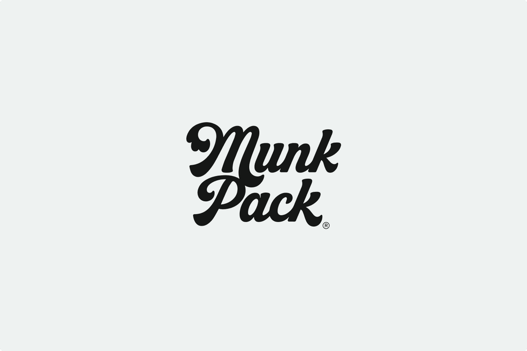 Stylized black text logo reading "Munk Pack" on a light gray background.