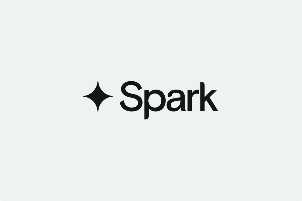 The image shows the word "Spark" in black text next to a stylized black star icon on a light gray background.