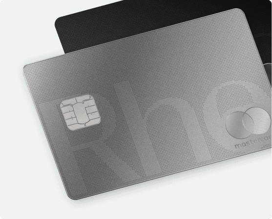 A close-up of two metallic credit cards, with one card featuring a chip and the word "mastercard" and a part of the logo visible.