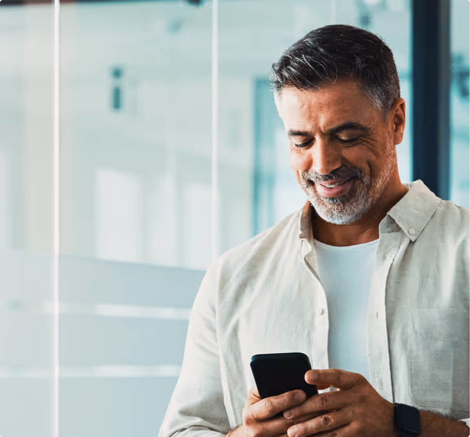 Older man using cellphone.